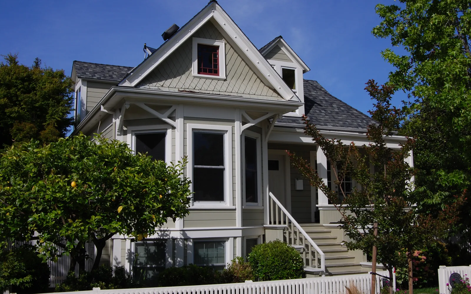 Victorian-era residential home on a tree-lined residential street in a Bay Area neighborhood
